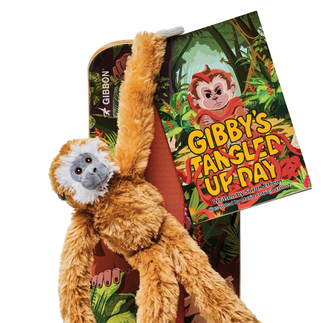 Children's book titled 'Gibby's Tangled Up Day' with a monkey illustration, on top of a GIBBY Slackboard, with a GIBBY Plush toy hanging off the board on a white background