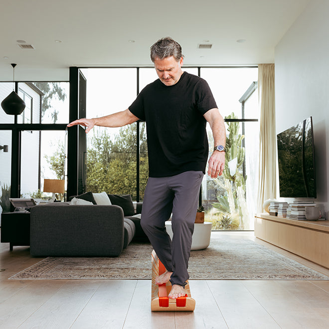 Man using a sunbeam slackboard plus in a modern living room